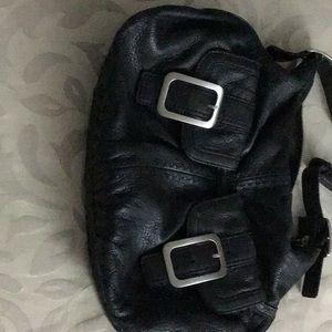 Cole Han black leather satchel purse with front pockets, buckles.